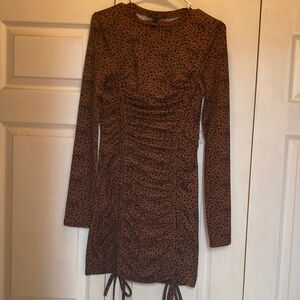 Cheta print dress with ruching down the front.  Size S